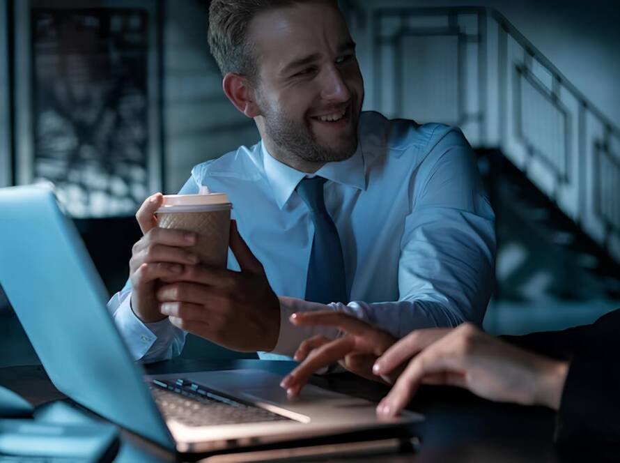 office manager man drinking coffee smiling his business partner laptop with cup coffee office female 2